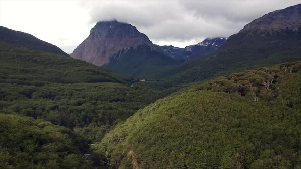 Drone aerial shot above forest, beautiful mountain view alt