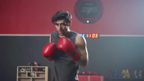 Caucasian sportsman athlete workout, exercise doing boxing and practice punch for health in gym. alt