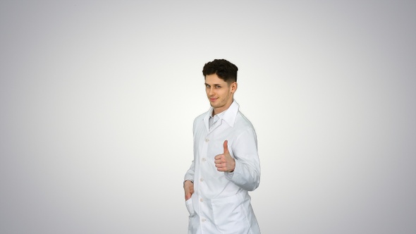 Young doctor wearing lab coat does front flip Victory! alt