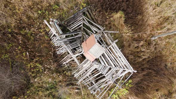 In the Field a Rural House with a Collapsed Roof Aerial View alt