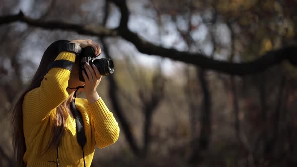 Woman Photographer Takes Pictures with the Camera