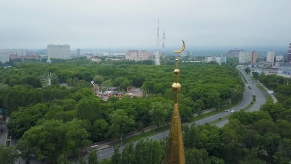 Mosque with Minaret with Golden Crescent, Modern Urban Landscape, Closeup Aerial Shot