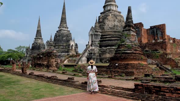 Ayutthaya Thailand at Wat Phra Si Sanphet Women with a Hat and Tourist Map Visiting Ayyuthaya alt