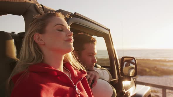 Couple in love enjoying free time on road trip together alt