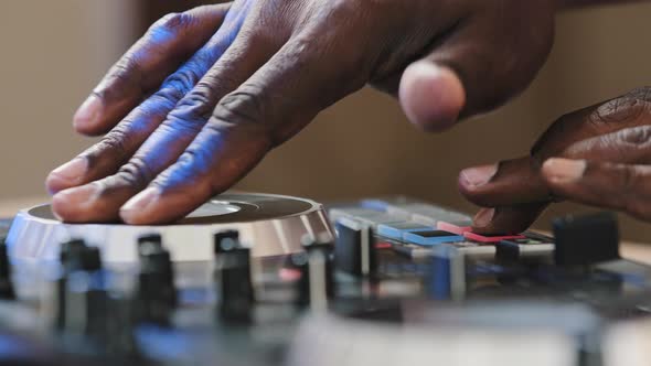 Closeup Unrecognizable DJ Man African Skin Male Hands Playing Live Electronic Music on Party in Club alt