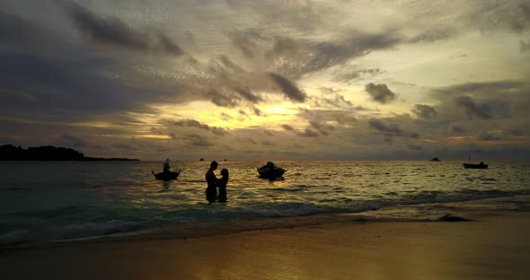 Fun couple after marriage in love spend quality time on beach on clean white sand background alt