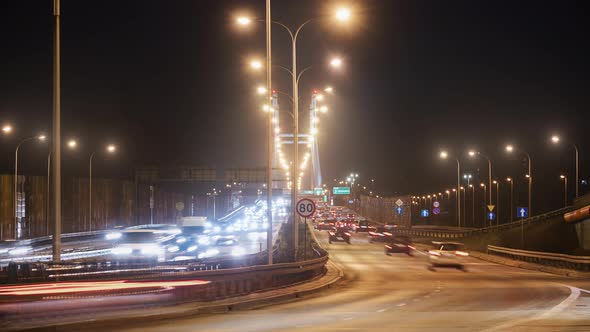 Timelapse Evening Traffic on Road Fast Motion Cars Driving on City Highway Leading to Illuminated alt