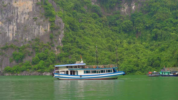 Ships Among the Rocks of the Halong Bay National Park in Vietnam Consisting of Thousands of Small alt