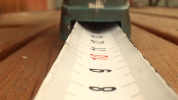 Roll of Measuring Tape in Motion Macro alt