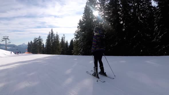 POV Beginner Girl on Skis and Amateur Skiers Slide Down on Ski Slope at Ski Resort alt