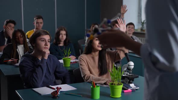 Cute Asian Girl Pupil Answering Teacher's Question alt