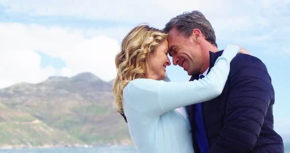 Romantic couple embracing face to face alt