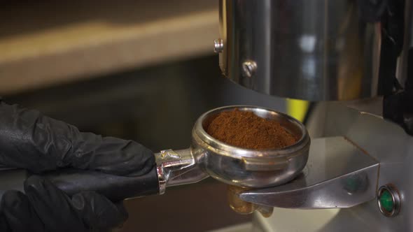 Professional Barista Worker Man Using Grinder Machine To Grind Fresh Coffee Beans for Make Hot alt