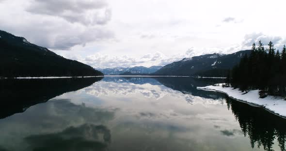 Mountain Lake Reflection Detailed Clouds Trees Still Lake Water Aerial Rise Above alt