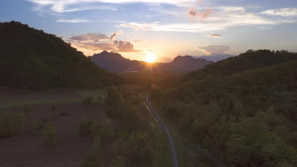 Aerial view Beautiful scenery The sunset behind the mountain. alt