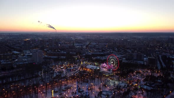 Aerial city amusement Gorky Central Park in sunset