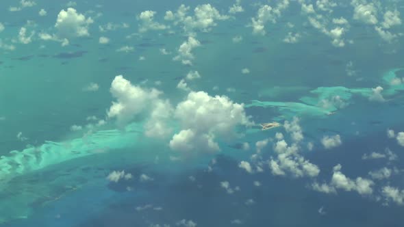 Flying over The Bahamas. Beautiful ocean colors. Actual aerial footage.