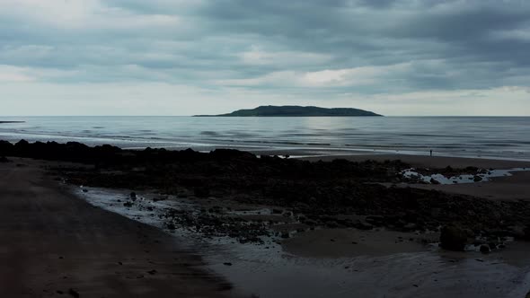 Low aerial view over beach landscape alt