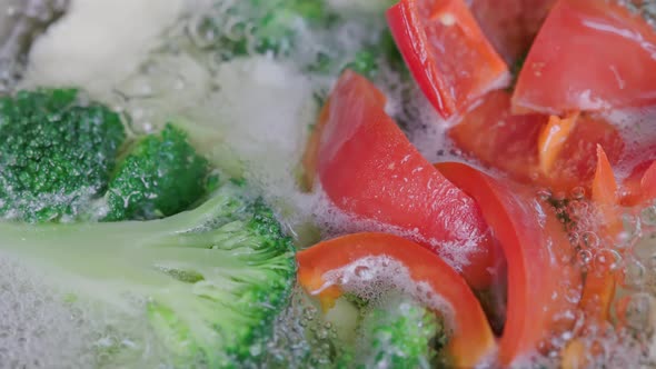 Boiling Broccoli Cauliflower and Red Bell Pepper Extreme Closeup with Slow Motion