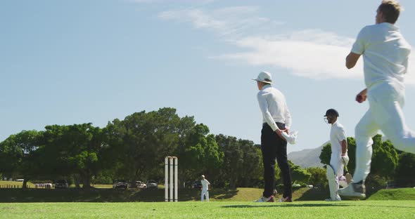 Cricket player throwing a ball as far as possible alt