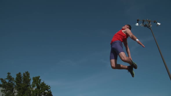 Track athlete doing long jump in super slow motion, shot on Phantom Flex 4K