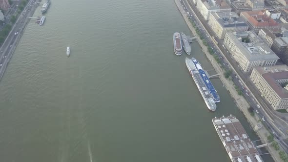 Aerial view of Danube river in Budapest city, Hungary, Boats floating on river. Ships moored, summer