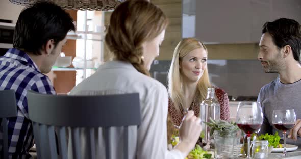 Blonde Woman and Man Talking Four Happy Real Candid Friends Enjoy Having Lunch or Dinner Together at