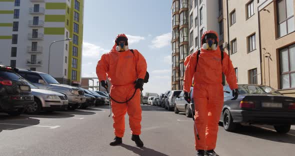 Employees Of The Chemical Laboratory With Sprayers Go To The Car. Editorial alt