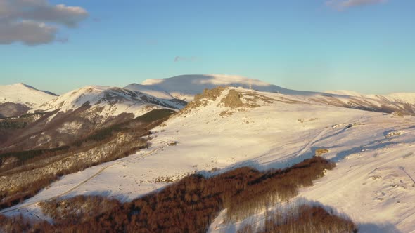 Aerial view at the mountain on a sunny winter day