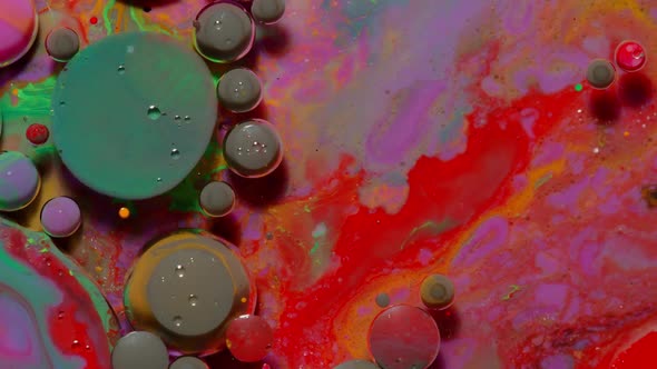 Ink Bubbles Mixed with Liquid Substance of Oil Milk Soap Bright Acrylic Paint on Colorful Surface alt