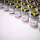 Coronavirus Covid 19 Vaccines On The White Laboratory Table 06 4K - VideoHive Item for Sale