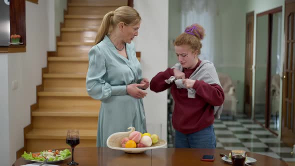 Elegant Middle Aged Mother Criticizing Hipster Daughter As Millennial Crying alt