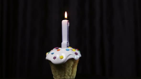 Cupcake with a Burning Candle with the Number 1