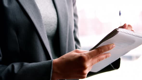 Counselor writing on the notepad alt