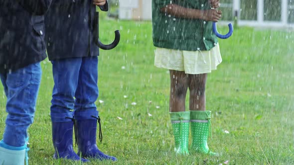 Children Laughing in Heavy Rain alt