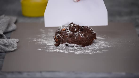 The Chef Kneads the Chocolate and Cocoa Cookie Dough and Shapes It