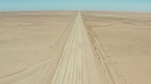 Empty Wide Long Desert Road On A Hot Sunny Day In Namibia, Southern Africa. - Wide Shot alt