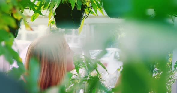 Beautiful woman counting while using digital tablet alt