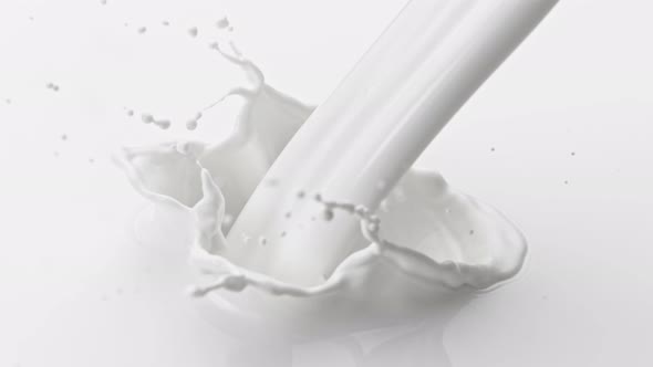 Super Slow Motion Shot of Pouring and Splashing Fresh Milk at 1000 Fps alt