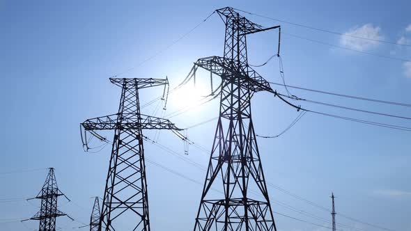 Time Lapse of Sunset with Transmission Electricity Steel Pylon Tower alt