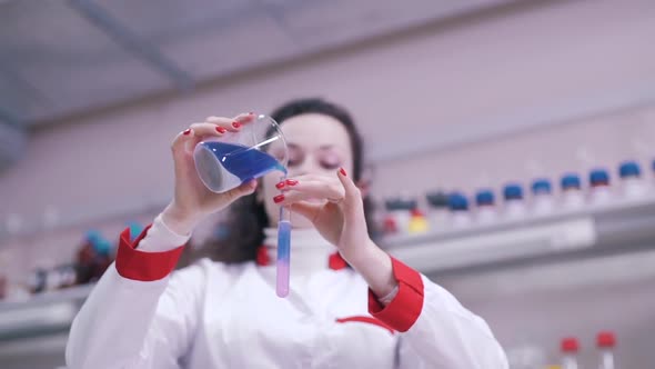 Scientist Mixes Liquids in Test Tubes