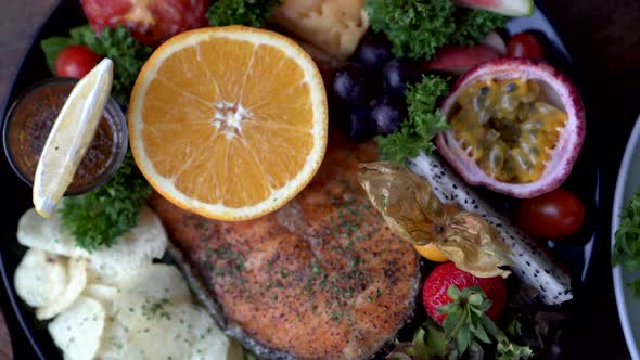 Rustic Seafood Steak Salmon Fillet Grill Serve With Fruits Orange Passion Fruit And Salad Top View