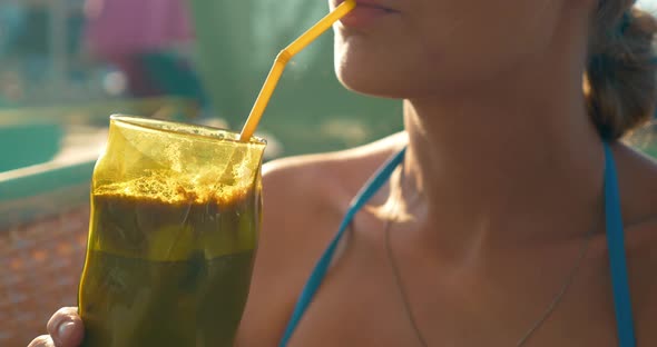 Woman Drinking Ice Coffee in Hot Day alt