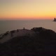 Mountain bikers reach epic trail peak, celebrate, golden Es Vedra drone - VideoHive Item for Sale