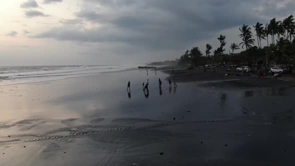 People on the Ocean at High Tide in Indonesia alt