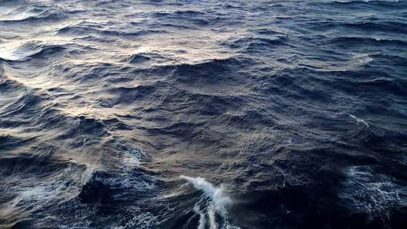 View of agitated water in open sea. There is fairly strong tide and water moves clearly. Nice light alt