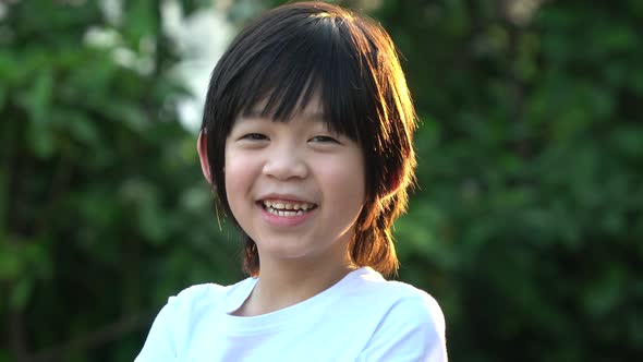 Happy Asian Child Smiling Outdoor alt