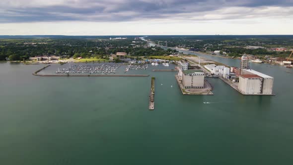 Aerial view of boats entering marina and port facilities on a beautiful green waters of Lake Erie. A alt