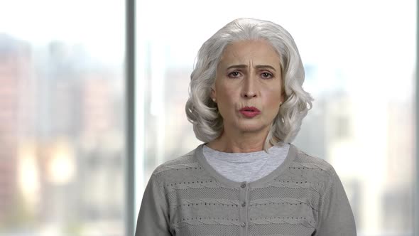 Portrait of Senior Woman with Toothache. alt