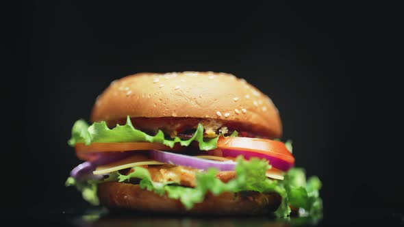 Big and Tasty Burger is Rotating on the Plate alt